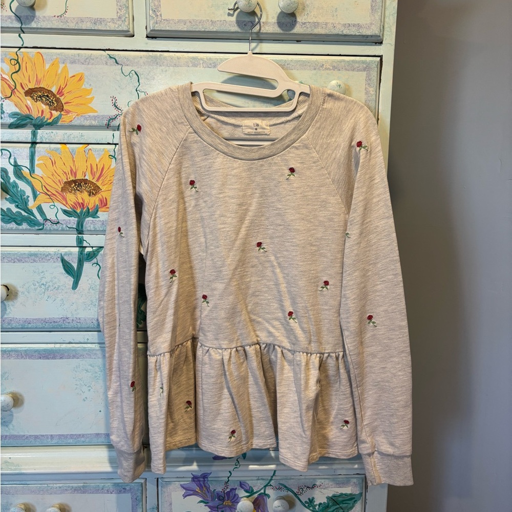 T.La Long Sleeve Peplum Top with Floral Embroidery